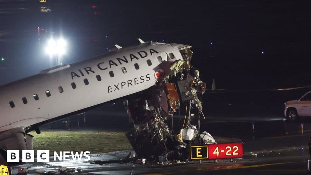 Plane and ground vehicle collide at New York's LaGuardia Airport halting flights